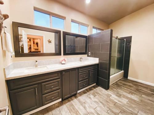 a bathroom with a double sink and a shower at Coastal Retreat - Just Steps to the Beach in Oceano