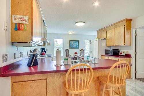 a kitchen with a counter top and two chairs at Chapin Home Near Boat Launch and Lake Murray! in Lake Murray Shores