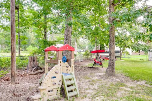 a playground with a slide and a play house at Chapin Home Near Boat Launch and Lake Murray! in Lake Murray Shores