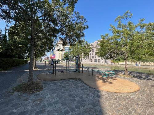 a park with a bench and a playground at Studio number 10 in Pantin