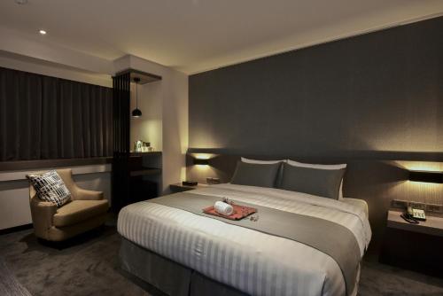 Postel nebo postele na pokoji v ubytování Wonstar Hotel
