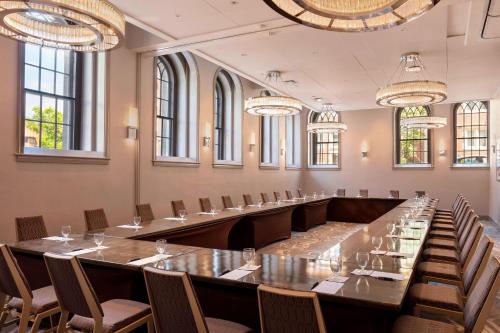 a large conference room with a long table and chairs at Sheraton Commander Hotel in Cambridge
