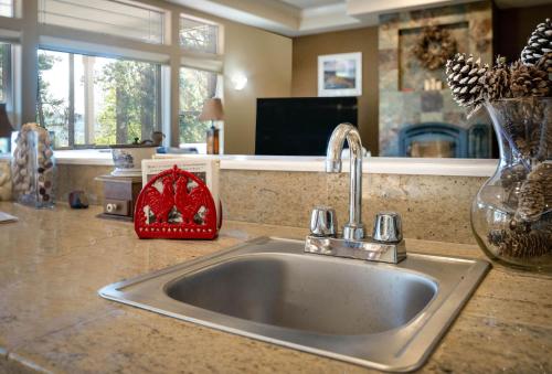 a kitchen counter with a sink in a kitchen at Cozy foothills home in Grass Valley