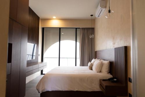 Postel nebo postele na pokoji v ubytování Moreira Hotel Boutique