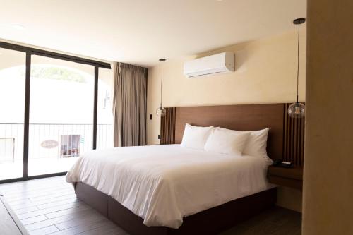 Postel nebo postele na pokoji v ubytování Moreira Hotel Boutique