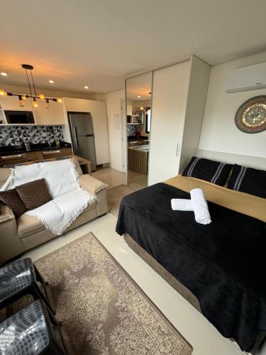 Postel nebo postele na pokoji v ubytování The Park- no coração de POA