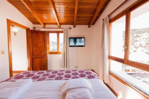 Postel nebo postele na pokoji v ubytování Tunqueley Hotel