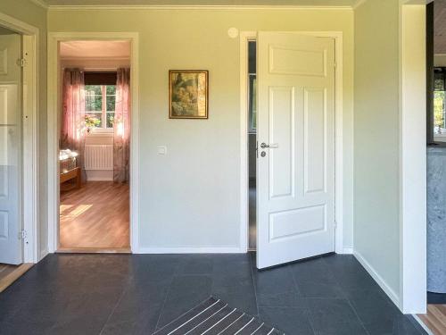 a room with a white door and a hallway at 6 person holiday home in Olofström-By Traum in Olofström