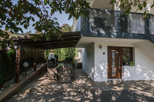 a view of a house with a porch at Apartments Sole in Podčetrtek