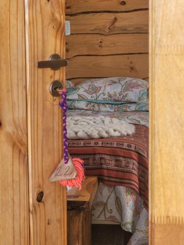 a door of a room with a bed in it at Nomade Patagonia Glamping & Domos in Trevelin