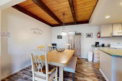 a kitchen and dining room with a wooden table and chairs at Chalet Court Manor in Zephyr Cove