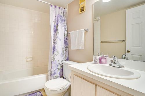 a bathroom with a sink and a toilet and a shower at Condo with Pool and Beach Access Near Theme Park in Deltona