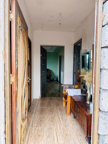 a room with a wooden desk and a hallway at Gndevaz homme in Jermuk