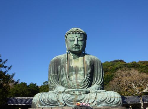 a large statue of a buddha in a park at Japanese Modern Inn Kamakura Rakuan Hanare---3min walk from Hase Station in Kamakura