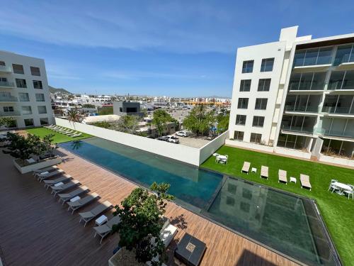 an overhead view of a building with a pool and chairs at Lumina at Marea Cabo San Lucas in Cabo San Lucas