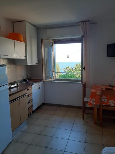 Kuchyň nebo kuchyňský kout v ubytování Residence Conca D'oro