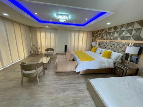 Postel nebo postele na pokoji v ubytování la perla finca hotel