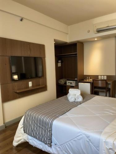 Cama o camas de una habitación en Hotel Vivenzo Savassi Belo Horizonte