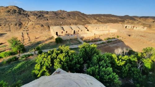 an aerial view of a building in the desert at oasis panorama in Bawiti