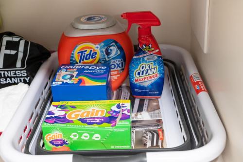 a drawer filled with toothbrushes toothpaste and cleaning products at Coastal Condo - Walk to Beach Pool Pickleball and Boat Ramp in Saint Augustine