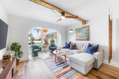a living room with a couch and a ceiling fan at Coastal Condo - Walk to Beach Pool Pickleball and Boat Ramp in Saint Augustine