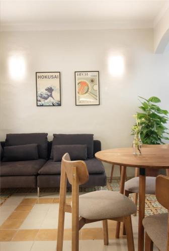 a living room with a couch and a table at Tonina in Rabat