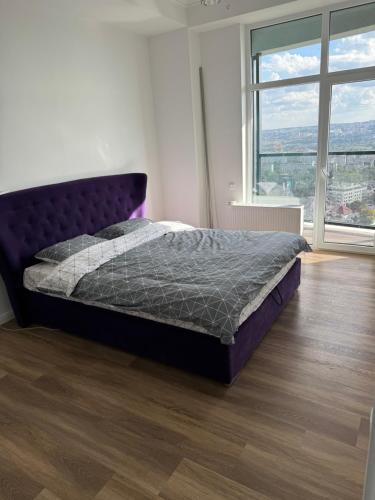 En eller flere senge i et værelse på Oasis apartment