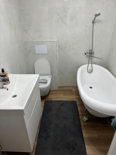 Et badeværelse på Oasis apartment