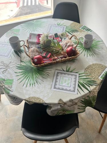 a table with a basket of food on top of it at Villas de encanto in Vilamarxant