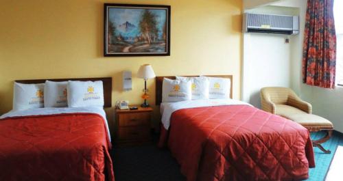 Katil atau katil-katil dalam bilik di Hotel Santo Tomas