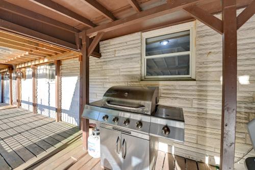 a grill on the back porch of a house at Red River Gorge Cabin Hike and Relax! in Rogers