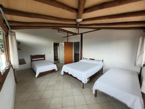 Ένα ή περισσότερα κρεβάτια σε δωμάτιο στο Casa Rústica Ilhabela
