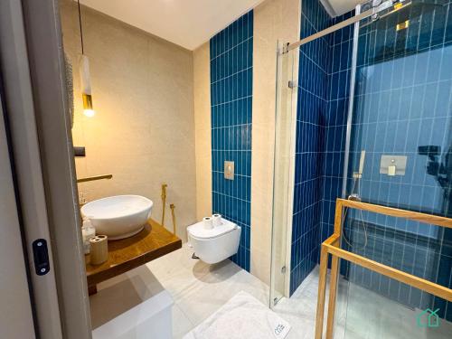 a bathroom with a toilet and a sink and a shower at The Penthouse Gammarth in Gammarth