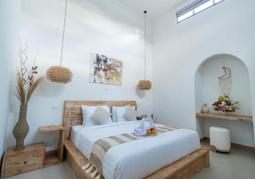 Ένα ή περισσότερα κρεβάτια σε δωμάτιο στο Jurassic Villa Canggu