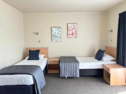 Postel nebo postele na pokoji v ubytování Arcadia Motel