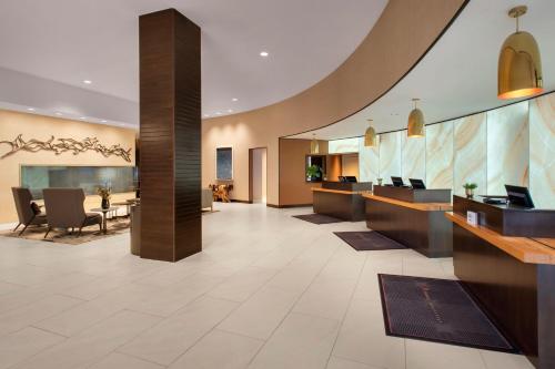 a lobby of a hotel with a reception desk at Boston Marriott Burlington in Burlington