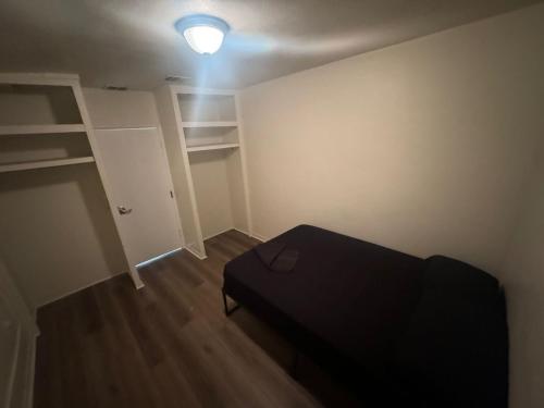 a small room with a bed and a closet at Van Nuys Homes for the Soul in Los Angeles