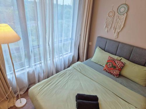 Ένα ή περισσότερα κρεβάτια σε δωμάτιο στο Serene and peaceful 2 Bedrooms 3 Pax - 10 Min to CIQ