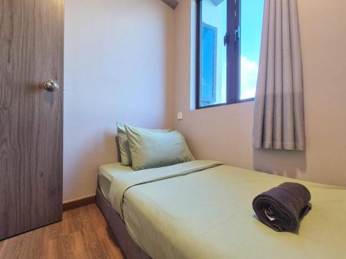 Ένα ή περισσότερα κρεβάτια σε δωμάτιο στο Serene and peaceful 2 Bedrooms 3 Pax - 10 Min to CIQ