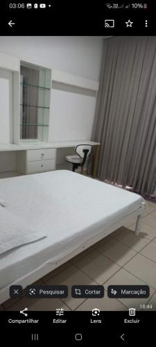 a picture of a bed in a room at Pousada da Ely in Navegantes