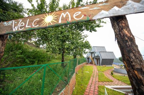 a wooden sign that says welcome to a house at Himadvaya- The Himalayan Prism in Almora