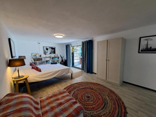 Una cama o camas en una habitación de Studio d'Artiste