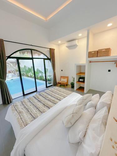 Postel nebo postele na pokoji v ubytování Stella Moon Villa Bali