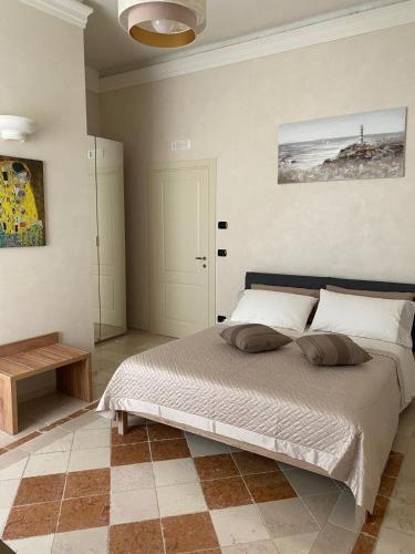 a bedroom with a large bed in a room at Easter Suite in Acquaviva delle Fonti