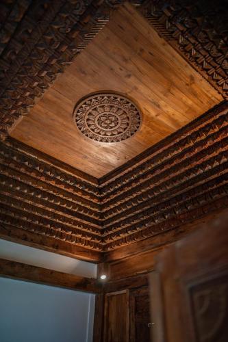 a wooden ceiling with a design on it at Umah Lusa in Munduk