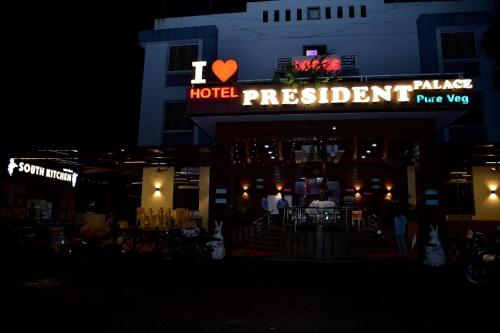 a hotel restaurant with a sign that reads hotel president at Hotel President Palace, Akkalkot in Akalkot