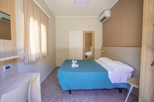 Postel nebo postele na pokoji v ubytování Hotel Tecla