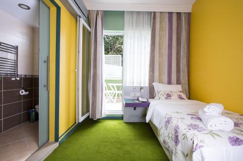 Katil atau katil-katil dalam bilik di Mini Harem Hotel