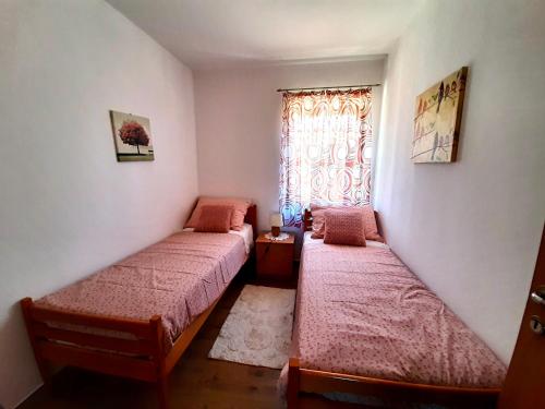 En eller flere senge i et værelse på Apartments Tre Pini