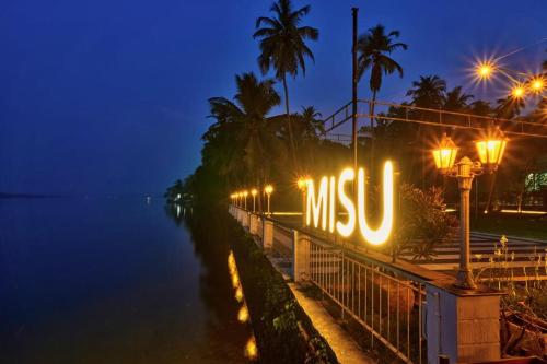 a sign that reads msu lit up at night at Blu Missel By The River in Panaji